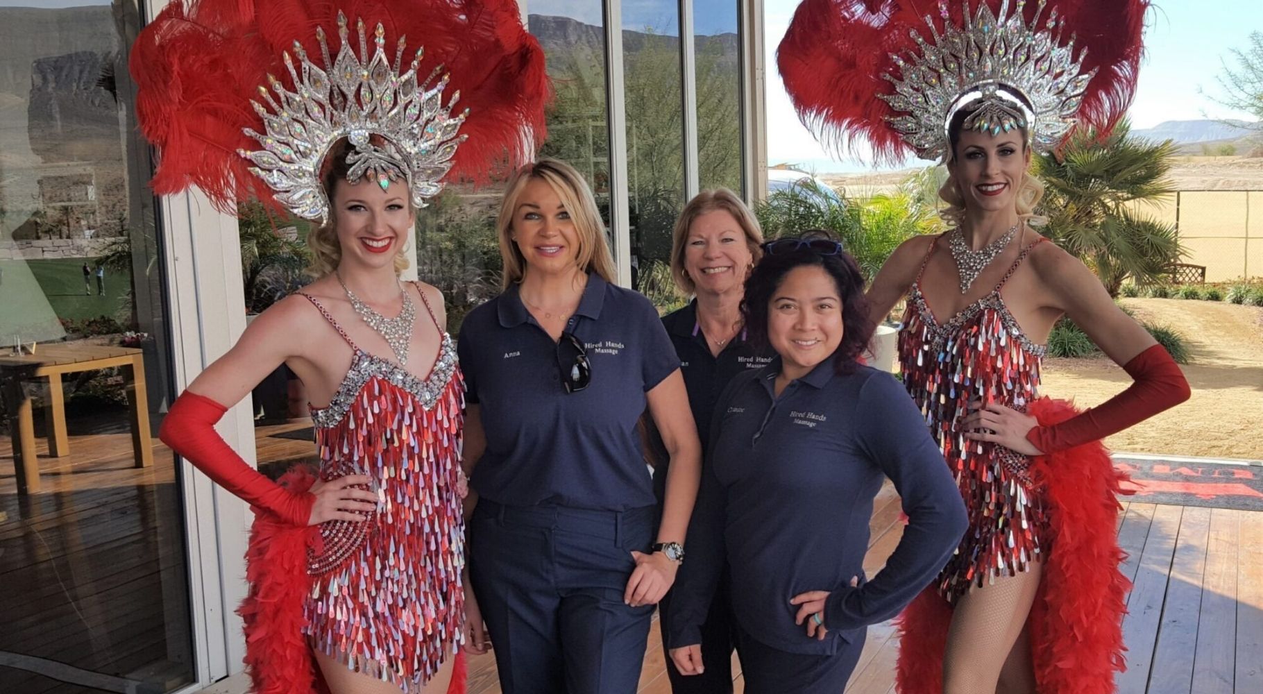 Vegas Chair massage staffers seen with Vegas show girls at a sports event in las Vegas, NV